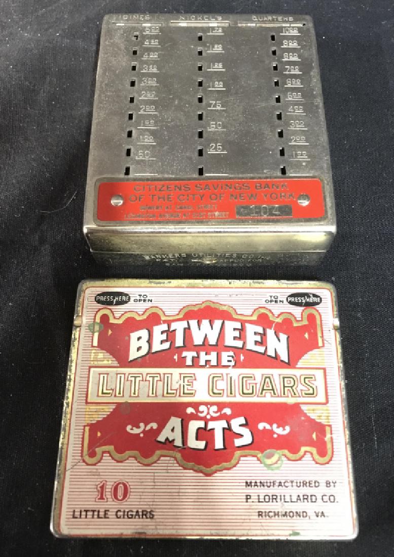 Lot 2 Vintage Cigar Box & Coin Bank: Lot includes 1 cigarette box that reads BETWEEN THE LITTLE CIGARS ACTS. & 1 Coin bank that reads CITIZENS SAVINGS BANK OF THE CITY OF NEW YORK. Coin bank measures approx 3 inches wide, 3.5 inches long