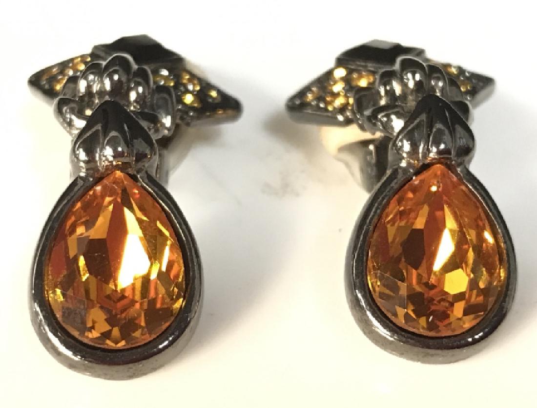 Pair Amber Toned Rhinestone Brooches: Pair Amber Toned Rhinestone Brooches. Each have amber toned tear drop with black & gold detail on top. Each measures approx 1.5 inches tall. VIntage Jewelry, Estate Jewelry, Fashion Jewelry