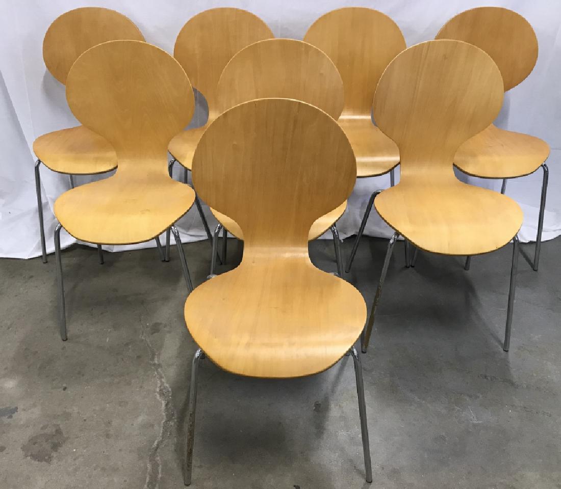 Lot 8 Mid Century Modern Chairs: Mid Century modern Shaped wooden chairs with metal Chrome legs. In the style of Arne Jacobsen. Chairs each measure approx 34 inches tall 17 inches wide 19inches deep. Danish Modern Style, Mid Century 