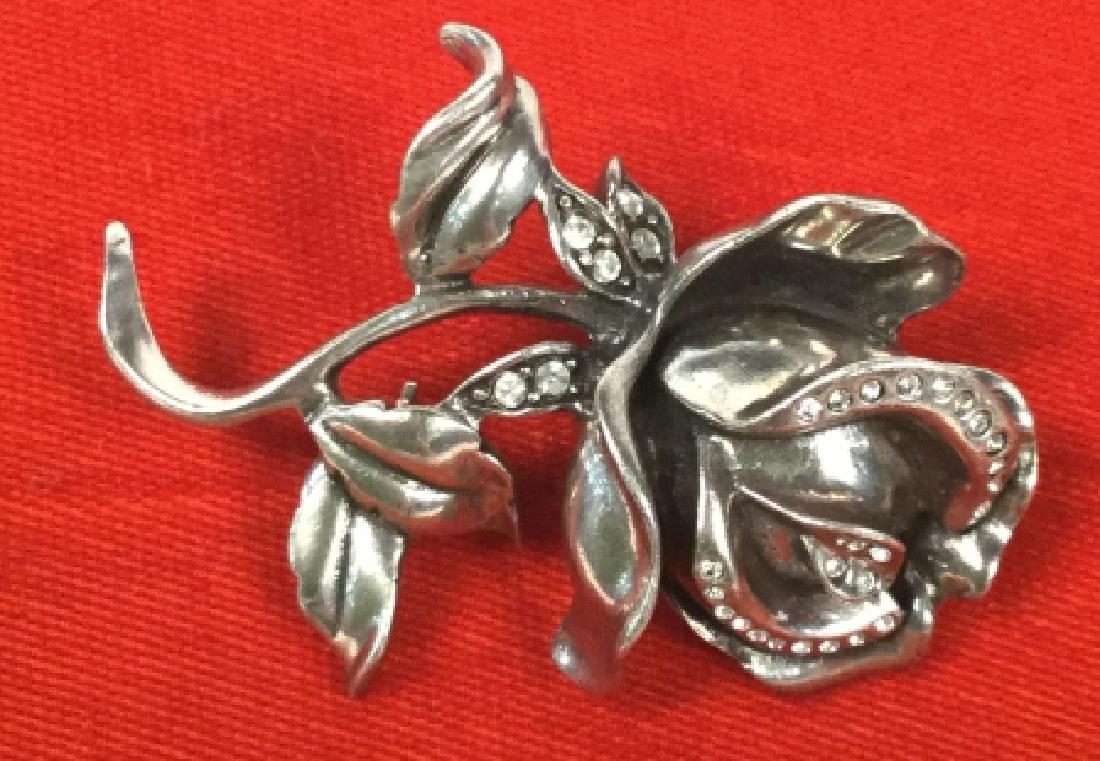 Signed ANNE KLEIN Rhinestone Rose Brooch: Silver tone Rose flower brooch with rhinestone details. Signed AK for Anne Klein on underside. Brooch approx 2 inches by 1.5 inches in width. Vintage Jewelry, statement brooch, designer jewelry. Estat