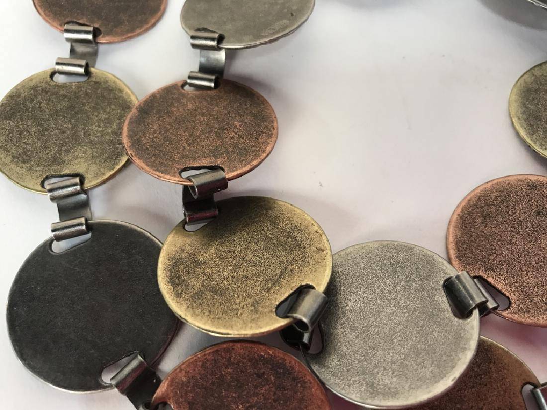 Vintage Metal Jointed Medallion Belt: Vintage Metal Jointed Medallion Belt, Made Of 22 alternating copper toned, Silver toned and gold toned metal disks, good condition, 42in from end to end, each medallion measures 1 1/4 in, 70s Style, V