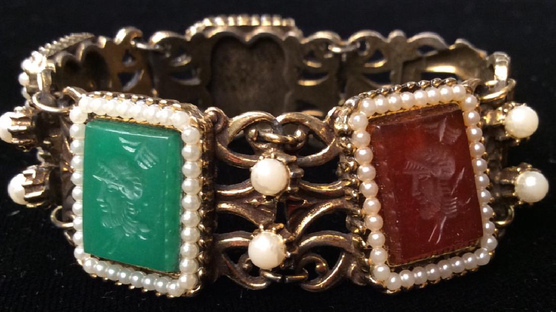 FLORENZA Vintage Women’s Bracelet, Jewelry: FLORENZA Vintage Women’s Bracelet. Gold toned metal body, pearlescent cabochon beaded details, inset rectangular colored glass details with etched warriors portrait. Measures approx 3 in in diameter