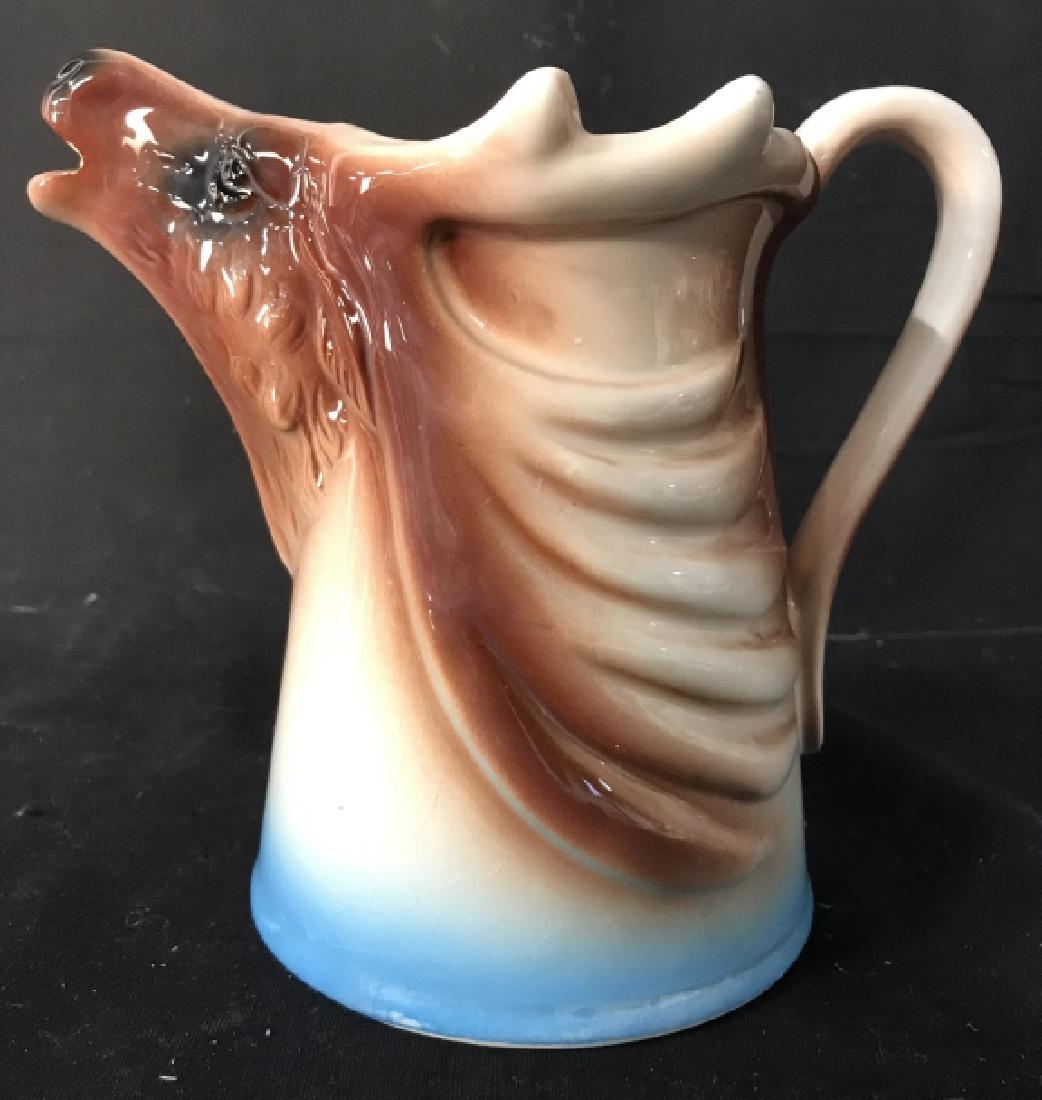 Painted Porcelain Buck Pitcher: Pitcher is porcelain, resembles shape of a buck. Measures approx 6.5 inches tall, 7 inches long with handle. Tableware,pitcher, tabletop accessory, decorative accessory 6