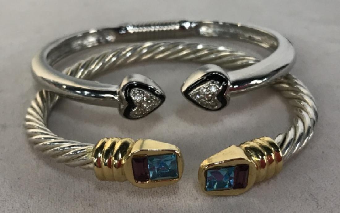 Silver Toned Colored Rhinestone Bangle Set: Silver Toned Colored Rhinestone Bangle Set, One with gold toned bands on twisted Silver toned metal, the other with polished silver toned with black enamel and rhinestone hearts, good condition, David