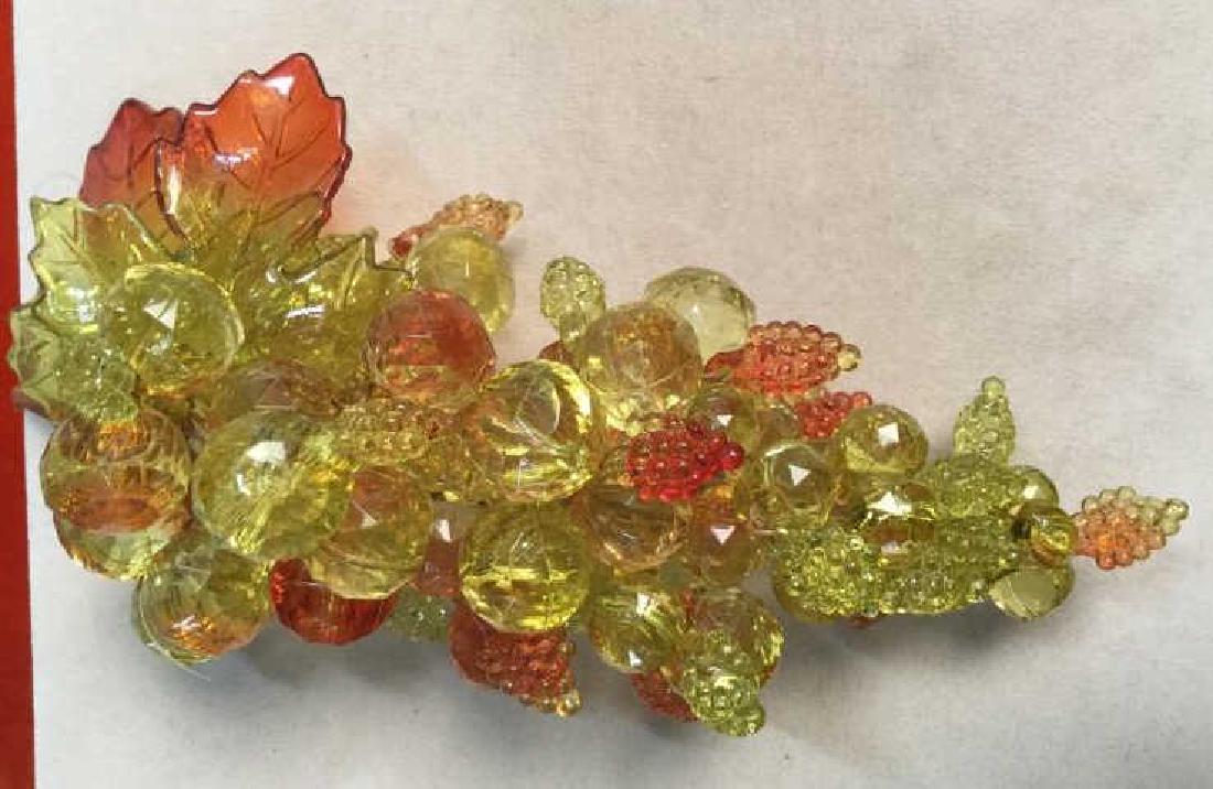 Decorative Bead Table Accessory Stylized as Grapes: Decorative bead table accessory stylized as grapes. Beads are translucent yellow and orange in tone. Approximately 7 inches in length by 3.5 inches in width. Tabletop accessory / fall autum Halloween