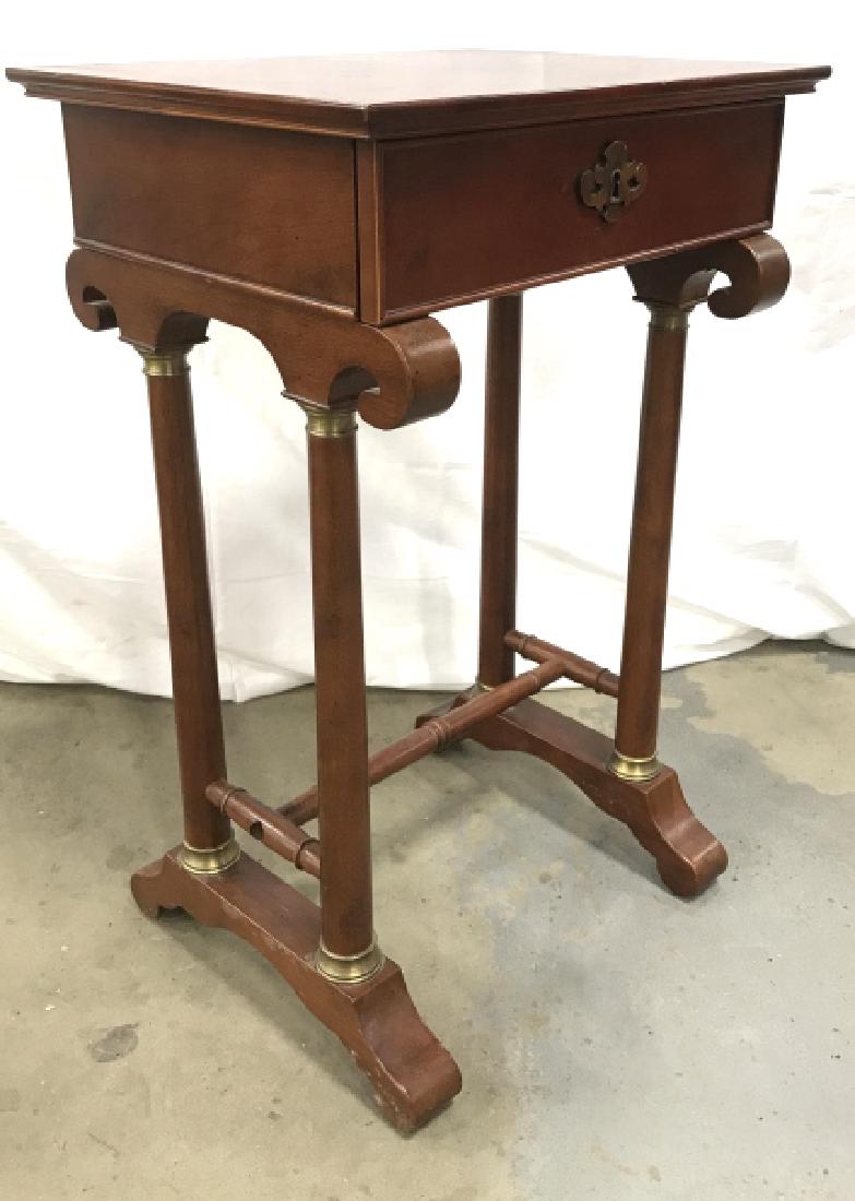 Bombay Company Mahogany Toned Side Table: Bombay Company Mahogany Toned Side Table With subtle marquetry top, carved scroll design, brass toned metal accents and hardware. Some small chips to top. Measures approx 28 inches tall x 18 inches wi