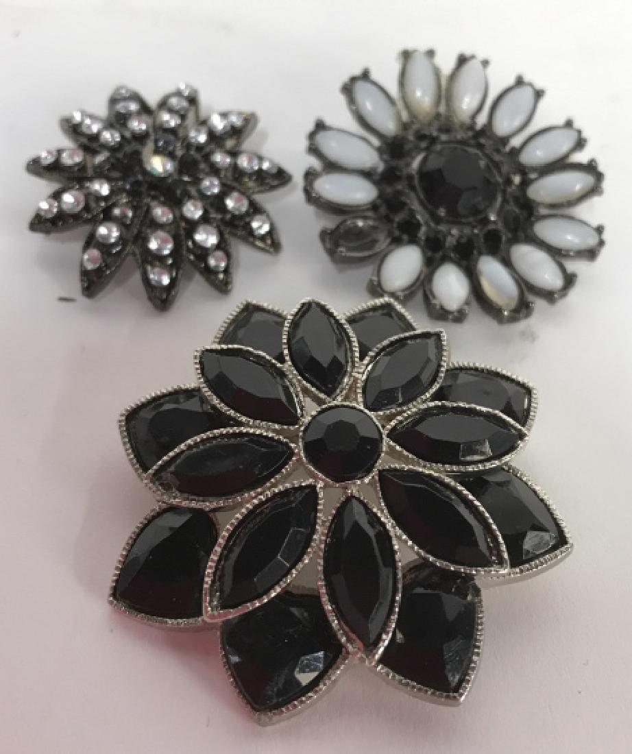 Group Vintage Floral Brooches Jewelry: Pins, Estate jewelry, floral designs, silver toned, rhinestone, marcasite, faceted beads, largest diameter 2 inches, one missing white bead
