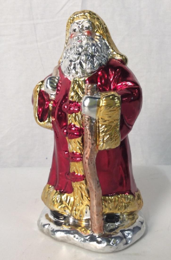 Ceramic Santa Figurine W Metallic Finish: Ceramic Santa Clause figurine with metallic finish. Santa is red, gold, and silver metallic in tone. Holiday / Christmas/ Santa Clause decor / figurine / tabletop accessory. Approximately 7.5 inches i