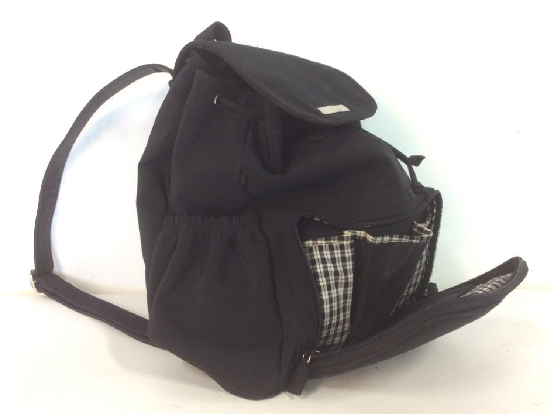 NINE WEST Black Tone Nylon Backpack: NINE WEST black tone nylon backpack/ rucksack. Backpack exterior has zipper closure pocket with additional pockets inside for pens / cell phone storage. Two pouches on both sides of the backpack. Uppe