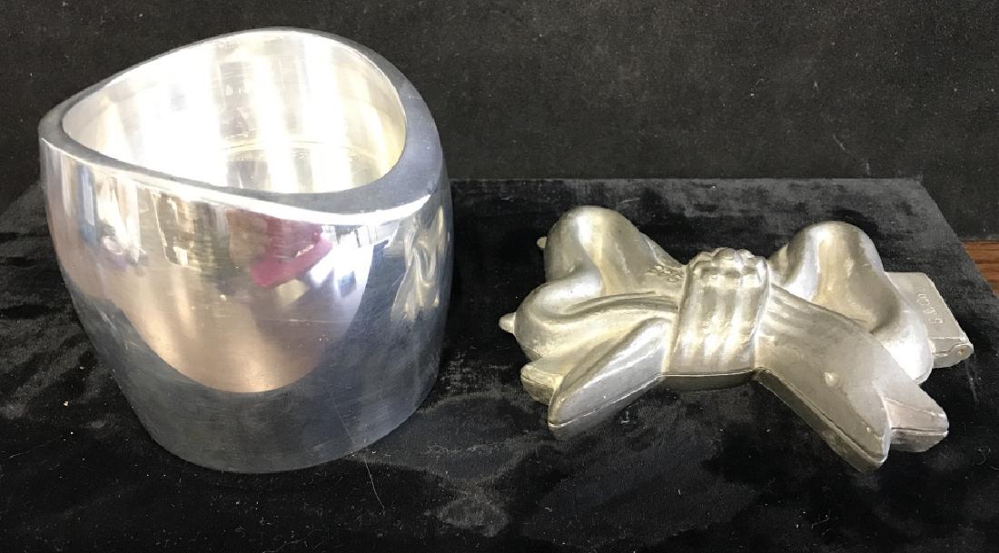 Silver tone Desktop Items: Silver Tone Desk Items, one signed Nambe Studio 1998, 8173, the other a vintage cookie mold shaped as a bow, desktop ornament 3 1/2 x 3 1/2 in., the bow measures 4 in x 4 in, marked S & co. , Vintage