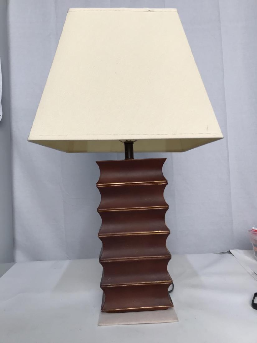 Asian Inspired burgundy Ceramic Table Lamp: Asian Inspired burgundy Ceramic Table Lamp, Formed Of square sections gold toned edges, good condition, not tested with shade, harp with matching finial, 15 in to top of Base, 5 in square, Asian Inspi