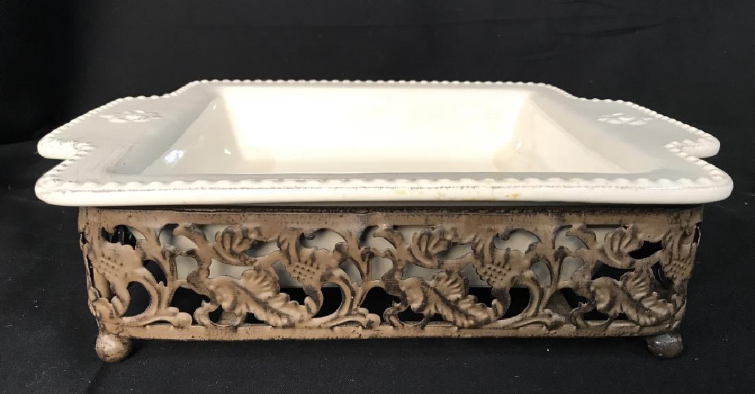 Ceramic Stoneware Serving Dish W Stand: Ceramic Stoneware Serving Dish with brown toned metal stand with acanthus leaf motif, marked on underside of dish, oven to table use, microwave and dishwasher safe stoneware Made in China. Measures ap
