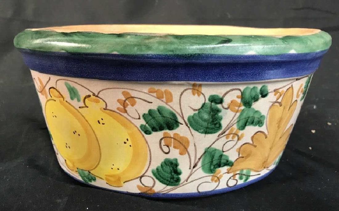 Hand Painted Italian Ceramic Planter: Planter is hand painted. Contains images of lemons, vines & leaves. Underside has tag which reads Made In Italy. Rim contains tones of green and blue. Measures approx 9 inches long 4.5 inches tall 7 i