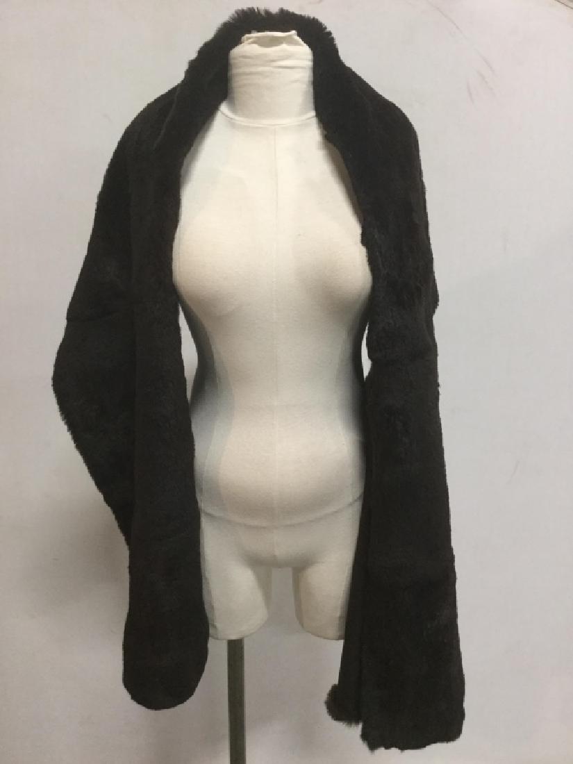 NEIMAN MARCUS Luxury Rabbit Fur Evening Shawl: NEIMAN MARCUS deep brown black toned rabbit fur Evening shawl / scarf. Label reads Neiman Marcus, Dyer rabbit skin, made in Italy. Inner lining is polyester. Approximately 76 inches in length by 19 in