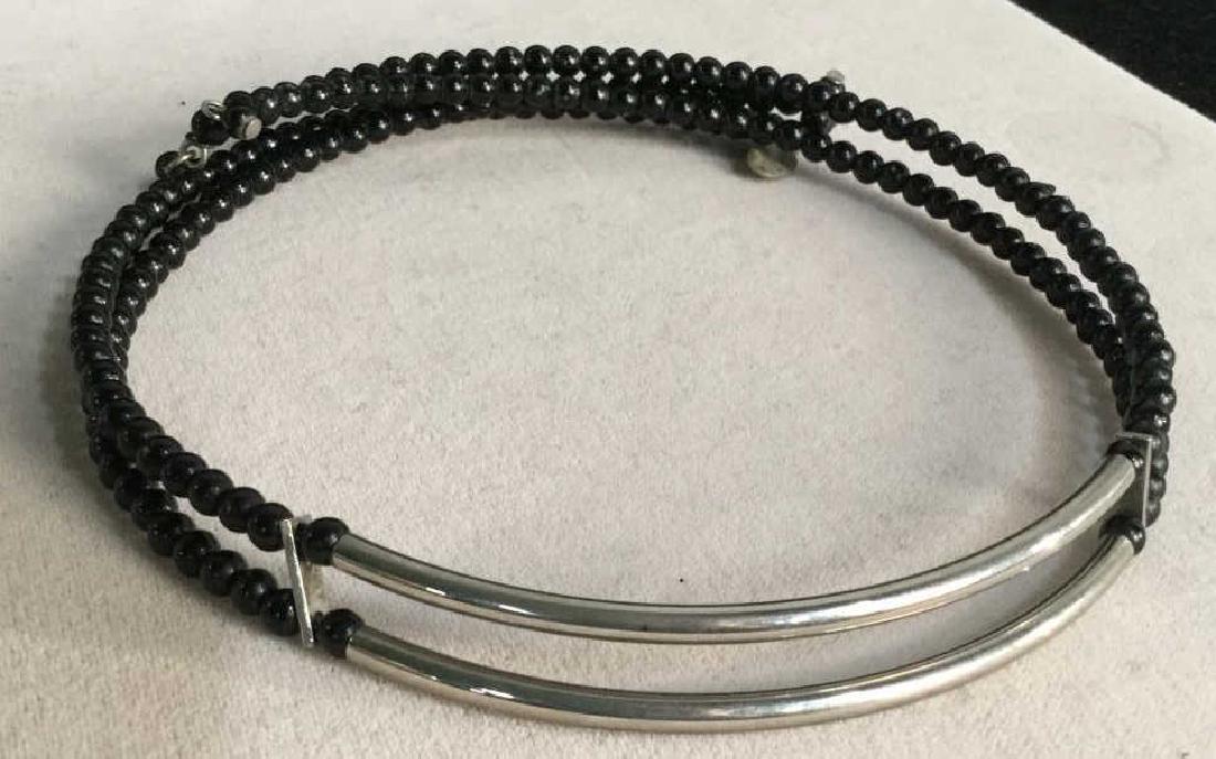Silver Tone & Black Beaded Choker Necklace: Silver tone and black bead choker necklace. Vintage Jewelry, statement necklace, costume jewelry. Circumference Of Necklace is 11 inches but expandable. Tag marked LC on end. Estate jewelry / Women's 