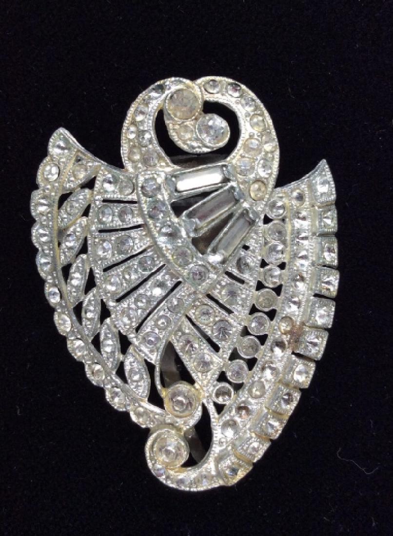 Vintage Art Deco Rhinestone Shoe Clip Pin: Vintage Art Deco Rhinestone Shoe Clip Pin. Vintage bejeweled show clip, could be worn as pin, curved body, white toned rhinestones. Some missing rhinestones, does not detract from overall image. Measu