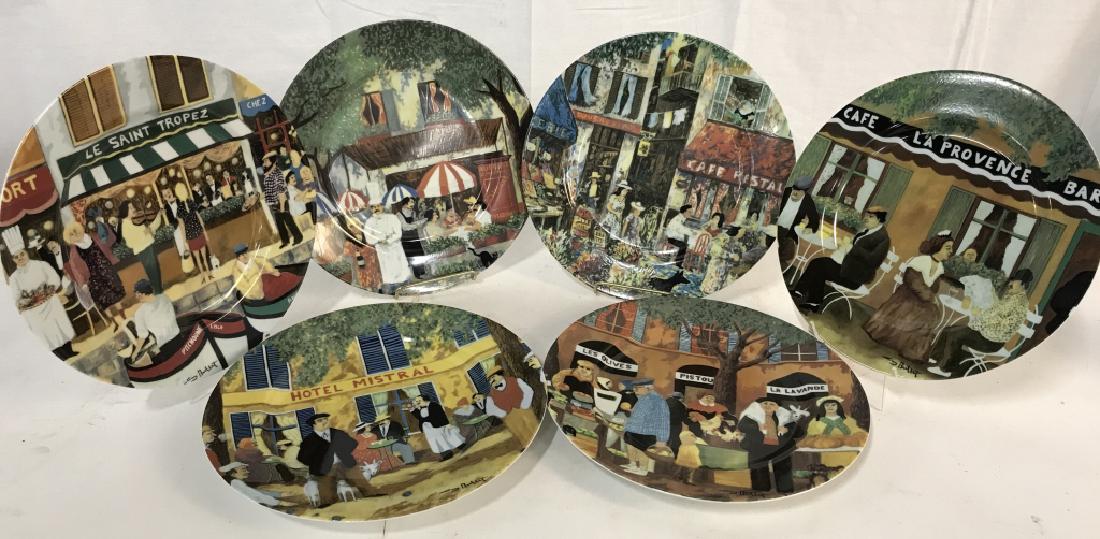 GUY BUFFET Set of 6 Porcelain Dinner Plates: Set of 6 fine porcelain dinner plates from the GUY BUFFET COLLECTION. Plates depict various printed scenes of people at restaurants, with titles including Le St. Tropez, Le Petit Prince, Marche Aux Fl