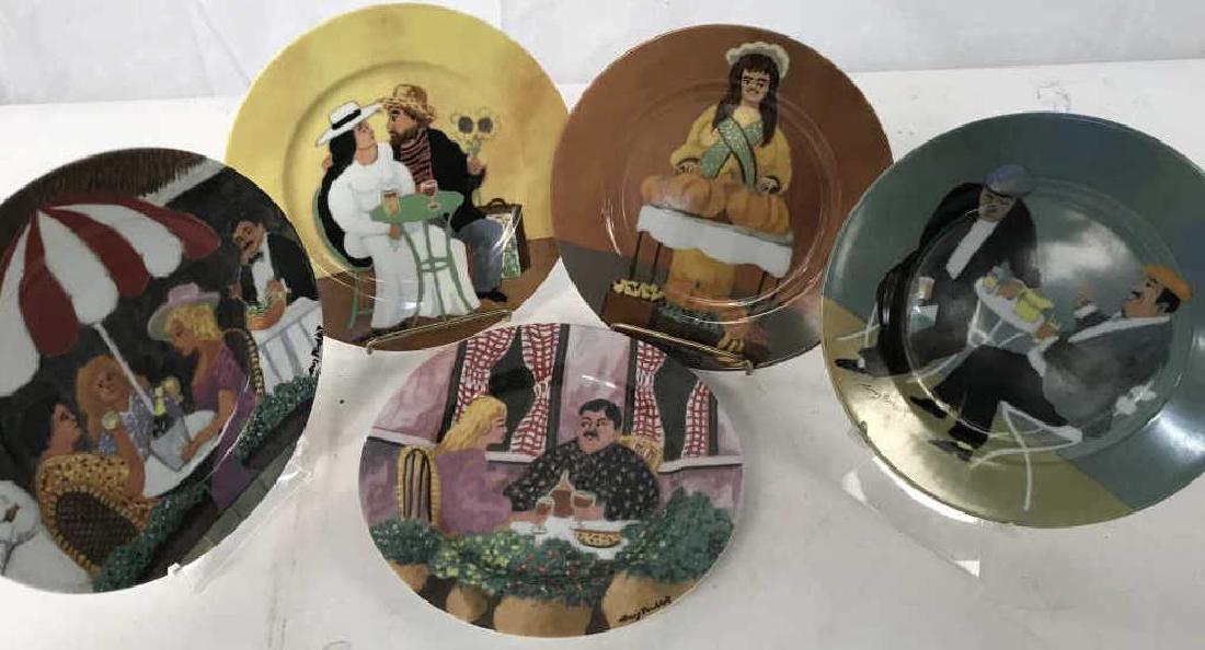 GUY BUFFET Set of 5 Porcelain Plates: Set of 5 fine porcelain / appetizer / salad / dessert / bread and butter plates from the GUY BUFFET COLLECTION. Plates depict various printed scenes of people at restaurants, with titles including Ren