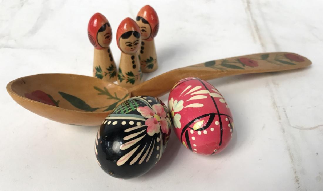 Group of Folk Art Hand Painted Wooden Collectibles: Group of folk art handoainted wooden collectibles / accessories, including two handpainted wooden eggs, a spoon, and three small-scale painted dolls. Largest item (spoon) is approx 10 inches in length