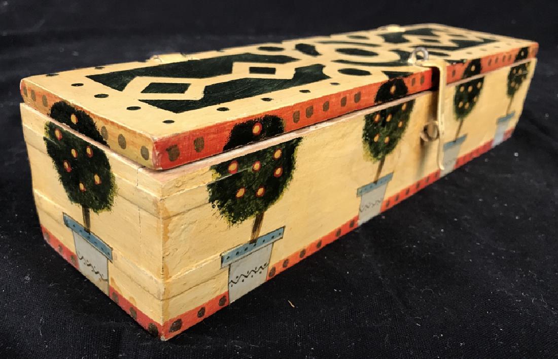 FORESIE Painted Wooden Keepsake Box: Keepsake box is wooden. Contains images of trees inside planters lid has painted geometric detail. Measures approx 11 inches long 2.5 inches tall, 3 inches deep. Decorative accessory, trinket, keepsak