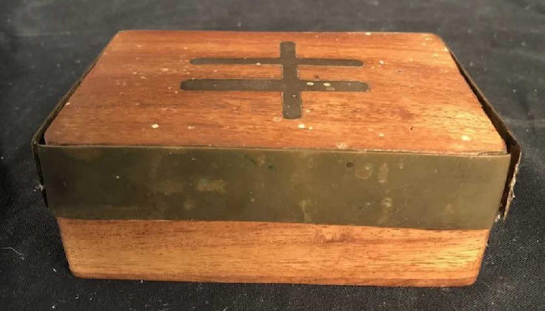 Vintage Wooden Keepsake Box Brass Inlay: Keepsake box is Vintage, possibly antique. Piece is wooden & Metal. Metal appears to be separating from wood. Metal brass inlay and banding, Measures app 5 inches long 3.5 inches wide 2 inches tall. 6