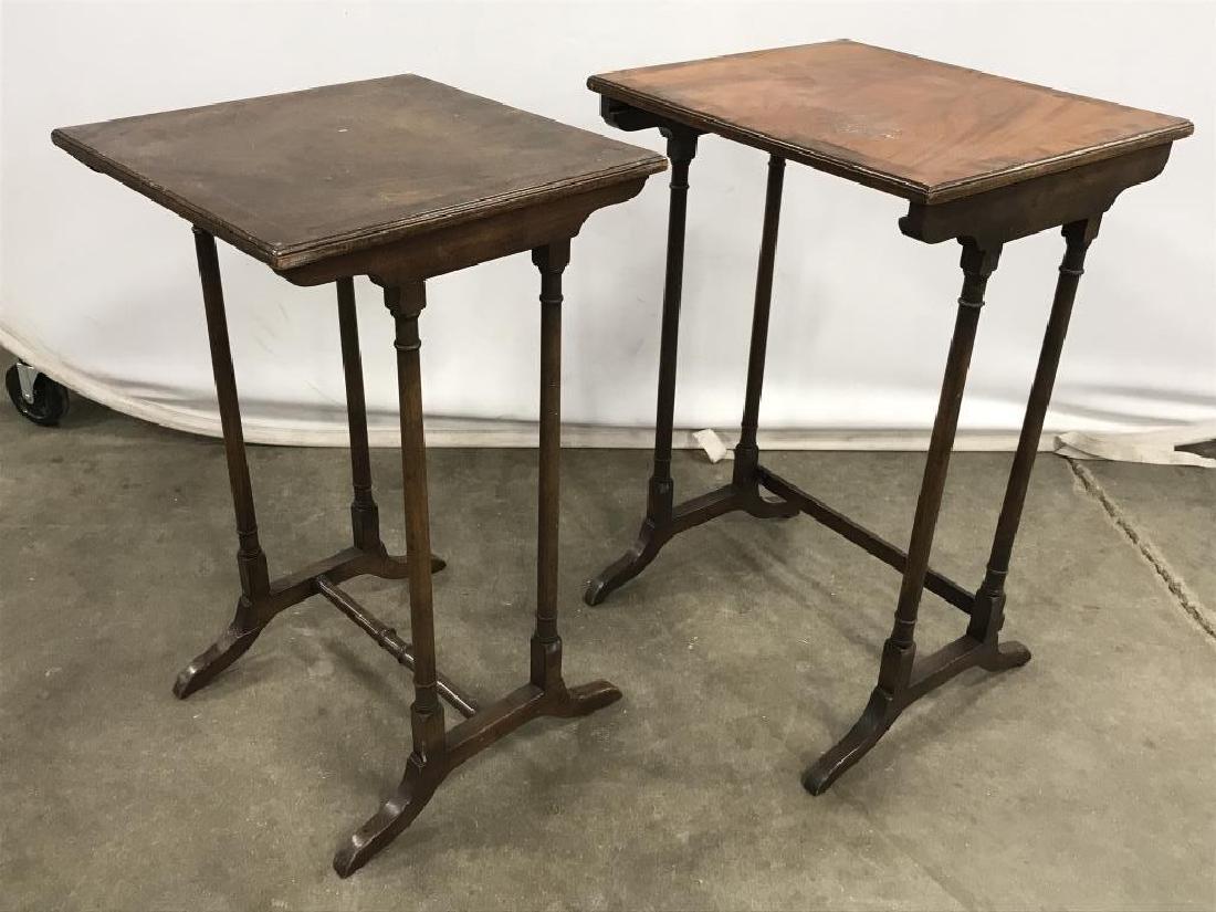 Pair of Vintage Wooden Nesting Side Tables: Pair of vintage wooden nesting side tables / stands. Smaller table is marked with serial number on underside. There is surface wear on both tabletops. Taller table approx 24 inches in height by 16 inc