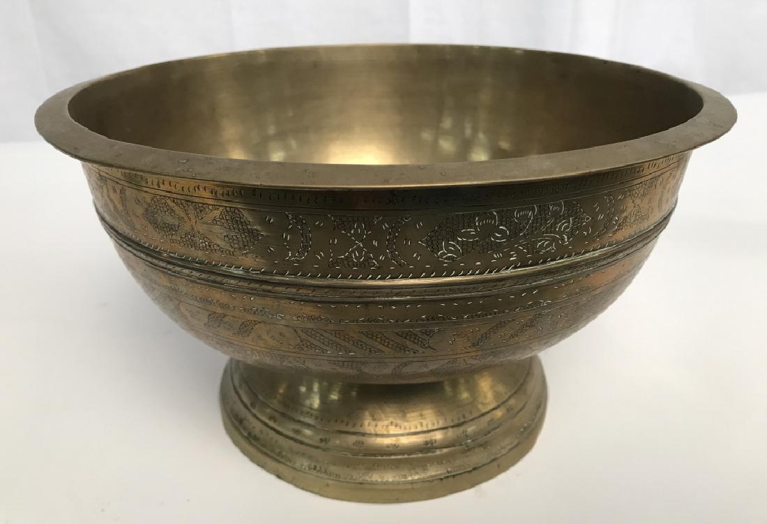 Asian Brass Toned Chalice Vessel: Asian Brass Toned Chalice Vessel, 6 in high x 10 3/4 in diameter, vessel on tapered base with etched Asian motifs and flat rim, possibly antique, rim with flat edge, some dents and scuffs, Asian Decor