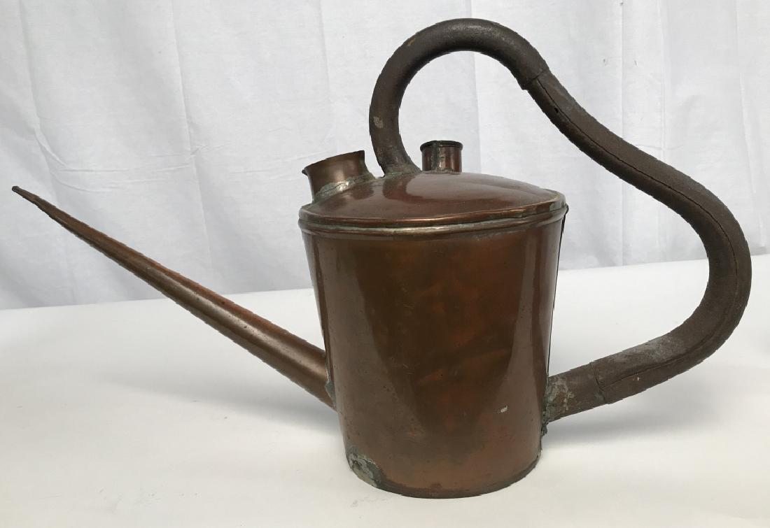 Antique Copper Oil Can Vessel: Antique Copper Oil Can, 13 in high x 24 in at widest point spout to out edge of handle, underside missing, signs of soldering, warm patina, rust to handle which may be other metal, Antique Utensils, F