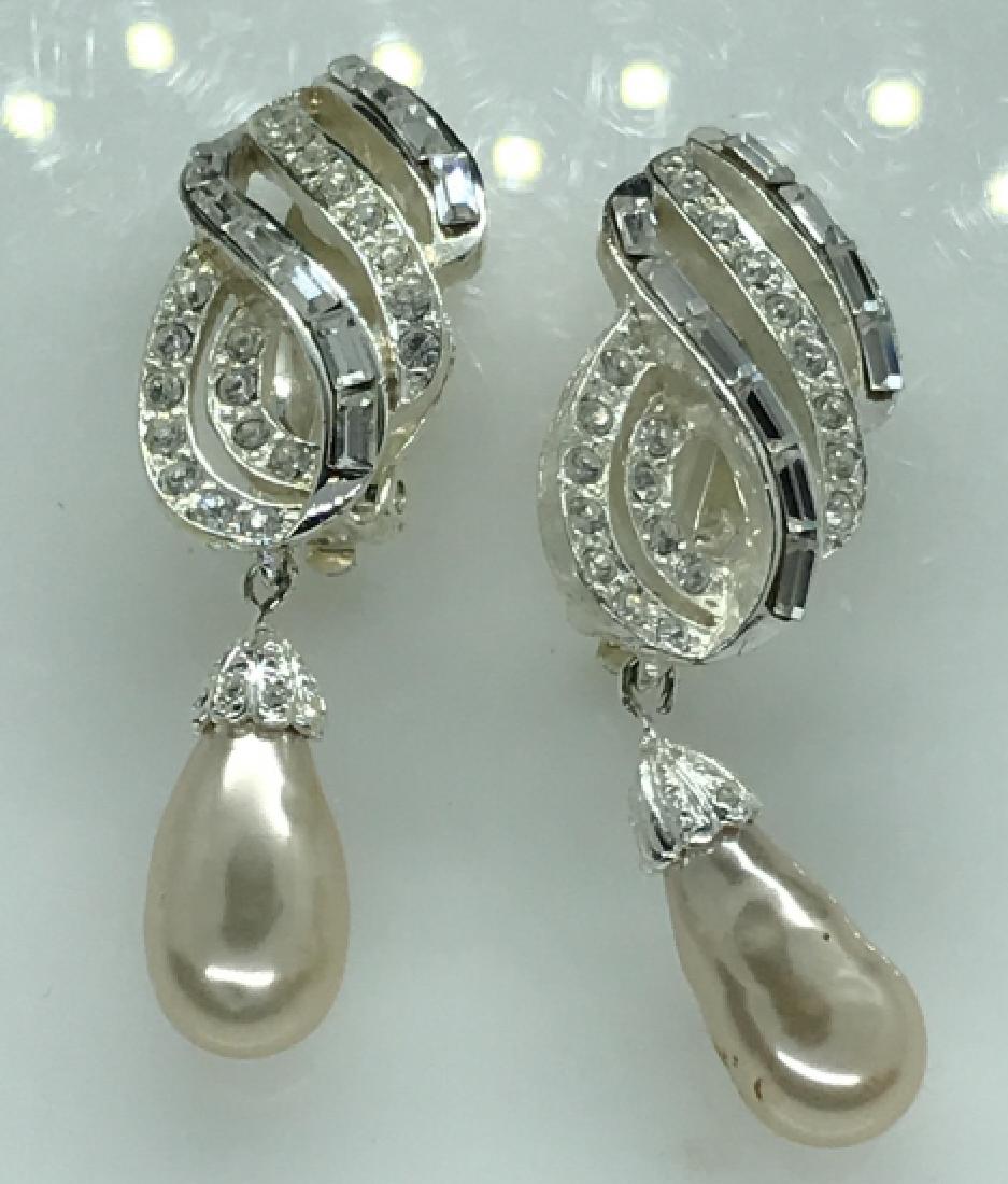 Carolee Signed Harry Winston Style Drop Earclips: Carolee Signed Harry Winston Style Drop Earclips, 2 1/8 in drop, Signed carolee on both outside of ear clip and on inside, good condition, simulated baguette and round cut diamonds with creamy simulat