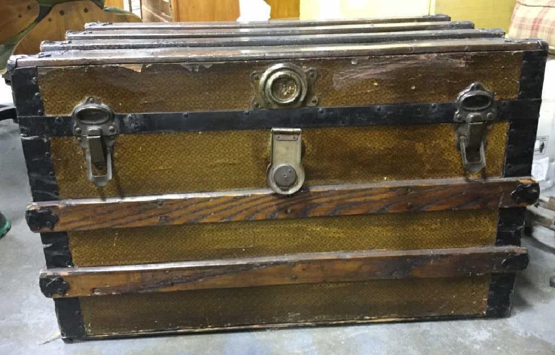 Vintage Wooden Chest W Paper Decoration: Chest is vintage possibly antique. Contains multi toned paper decoration in some areas. Contains evident wear and tear. Measures approx 31 inches long 20 inches tall 17 inches deep. Chest, storage che