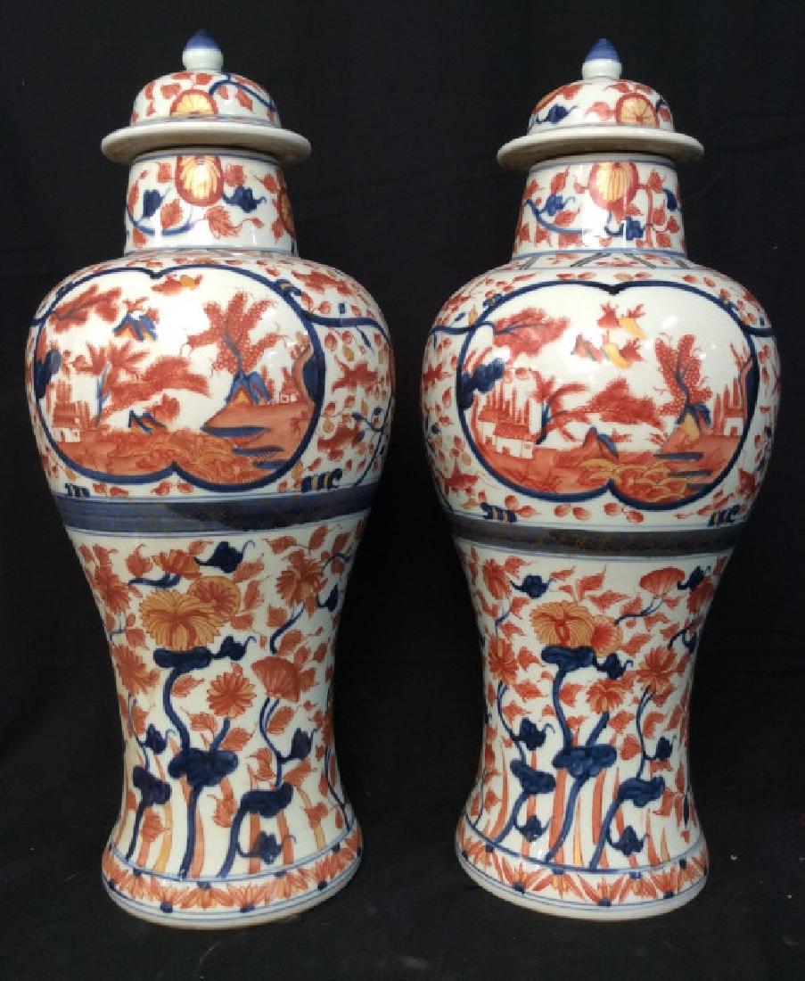 Pair Vintage/Antique Signed Asian Ginger Jars: Pair Vintage/Antique Ginger Jars. White toned ceramic porcelain ginger jars with lids, decorated with rust red toned floral design sign with blue toned details, also features scenic artwork. Measures 