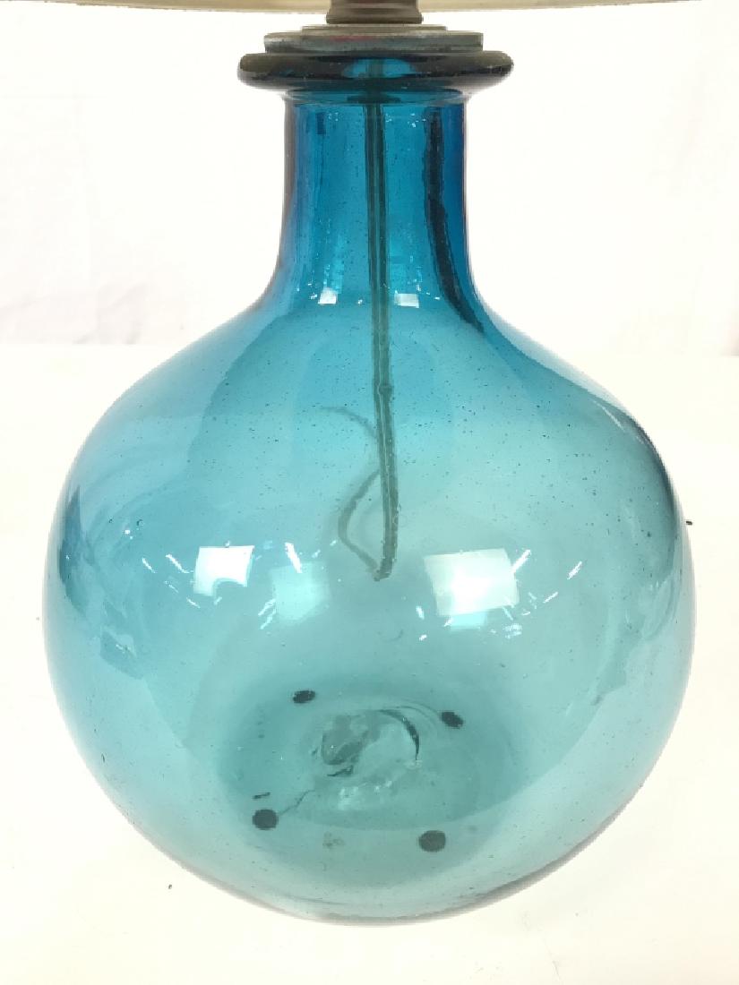 Hand Blown Art Glass Lamp W Shade: Lamp is aqua blue toned. Underside has pontil. Measures approx 21 inches tall 8 inches wide. Shade has some wear. Hand blown art glass, hand blown lamp, home lighting, home accessory, home decor. Come