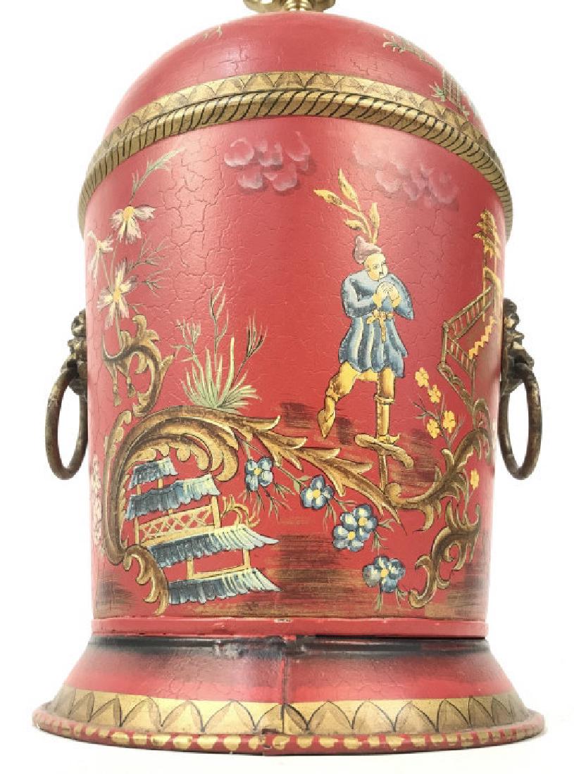 Vintage Asian Painted Red Gold Metal Lamp: Lamp is red toned with painted depictions of birds, flowers, leaves, human figures and Asian Garden and architecture. Contains gold toned loop style handles on sides with lion head detail. Includes fi