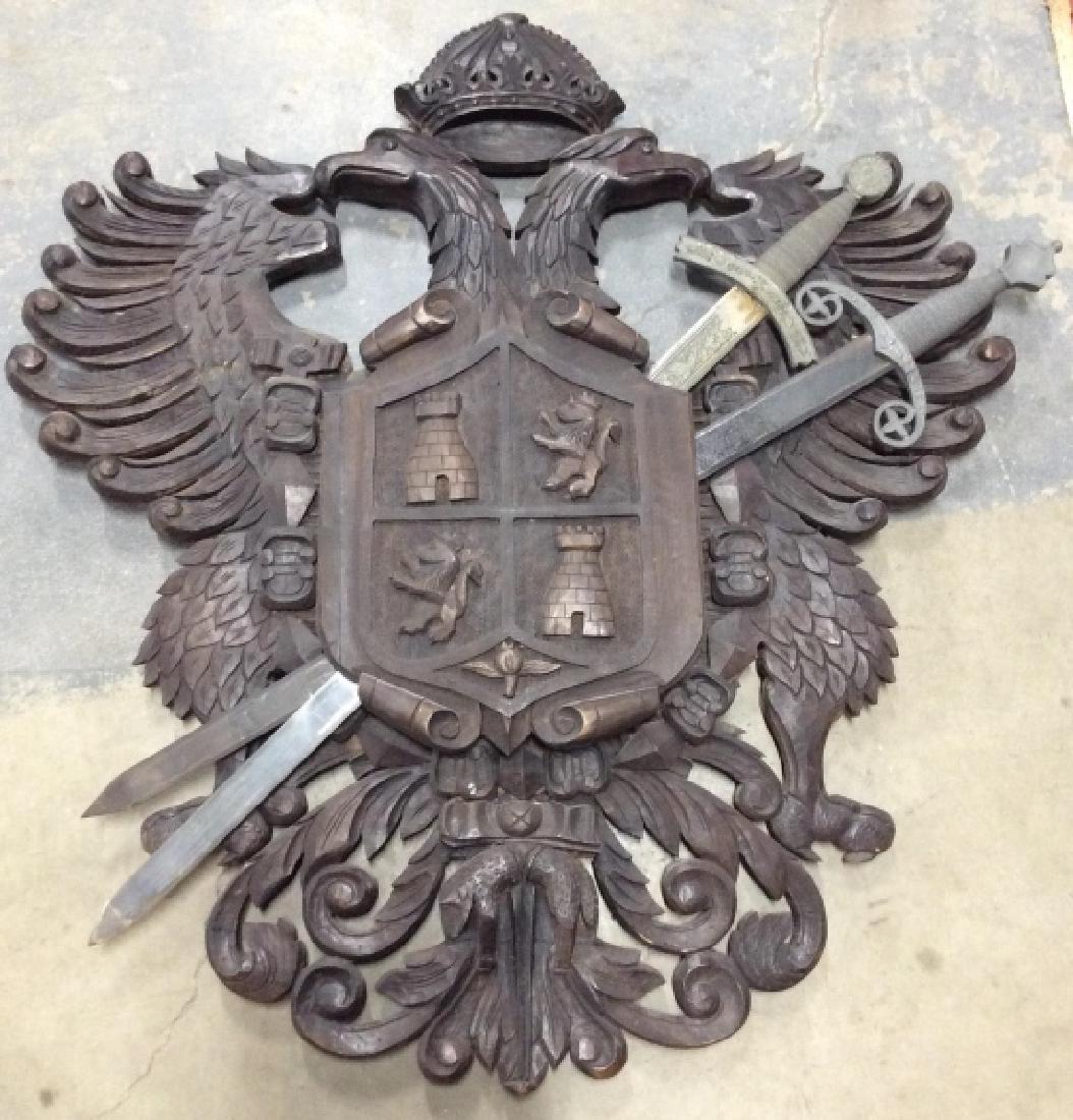 Antique Carved Wood W Metal Coat of Arms: Antique Intricately Carved Coat Of arms featuring eagle and other animals, crest shield with two metal swords going through. Historic accessory, family heirloom, ancestry, home decor, home accessory, 