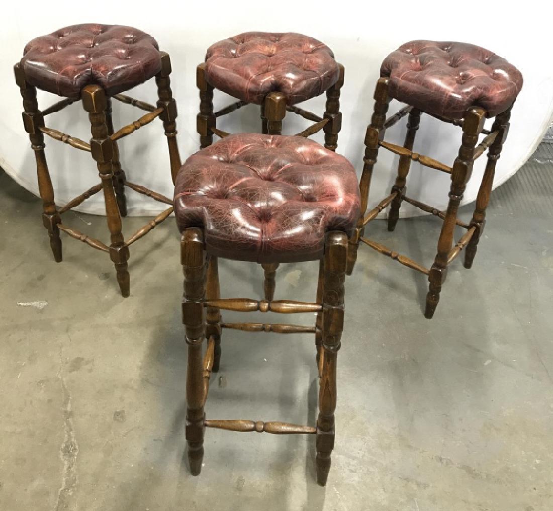 Set 4 Wood And Leather Chesterfield Style Stools: Set 4 Wood And Leather Chesterfield Style Bar Stools. A set of bar Stools with dark red leather tufted seats and dark toned turned wooden legs and rungs. Some wear and discoloration to leather seats t