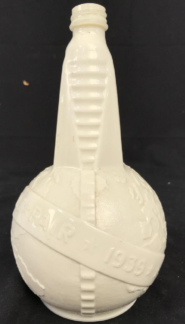 1939 Worlds Fair Milk Glass Vinegar Bottle: Vinegar bottle is vintage is White Toned has beveled text which reads 1939 Worlds Fair. Does not include cap. Measures approx 9 inches tall 5 inches wide. Barware, collectible milk glass, collectible 