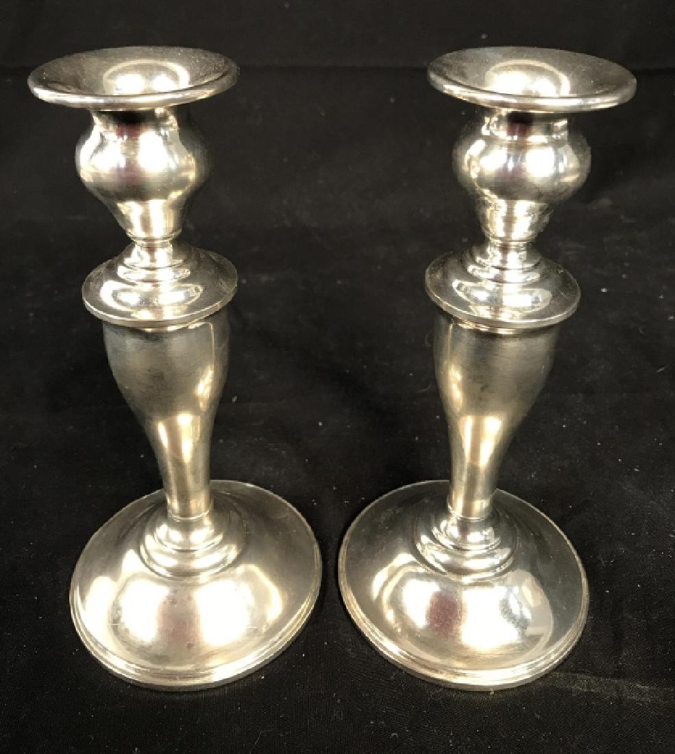 Pair GORHAM Sterling Weighted Silver Candlesticks: Lot includes 2 Sterling silver candlesticks. Underside of each reads GORHAM STERLING WEIGHTED 815. Each measures approx 7 inches tall 3.25 inches wide. Candlesticks, weighted sterling, luxury tabletop