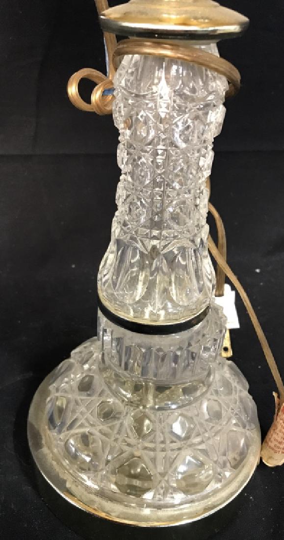 Cut Glass Lamp With Rotating Arm: Cut Glass Lamp With Rotating Arm. Includes cream toned shade. Base is metal and silver toned. Measures approx 20 inches tall 5.5 inches wide without shade. Home lighting, home accessory, home decor, h