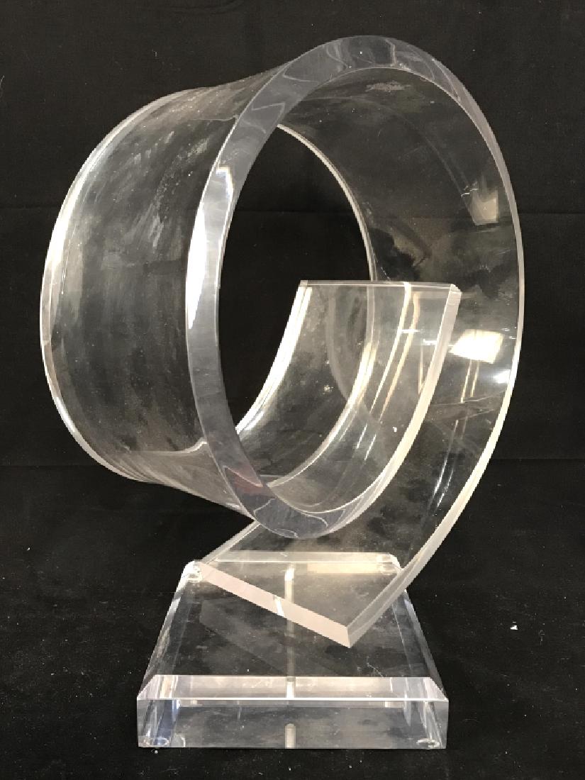 Lucite Spiral Sculpture: Sculpture has square shaped base. Piece is lucite and spiral shaped. Measures approx 16 inches tall 13 inches wide. Lucite Sculpture, lucite Artwork. Decorative accessory, home decor, sculpture, artwo