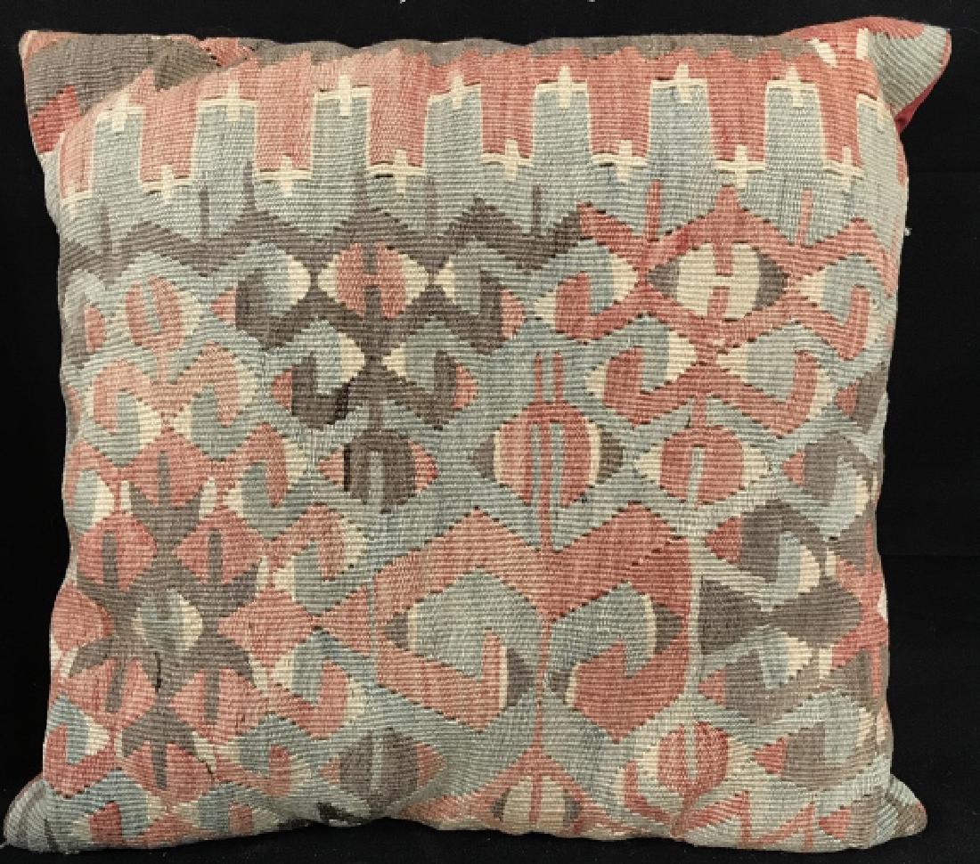 Hand Made Kilim Carpet Pillow: Hand Made Kilim Pillow With blue, grey, beige, and light red toned geometric shapes, reverse is in a red toned fabric, measures approx 17 inches square, needs light spot cleaning on reverse. Kilim Pil