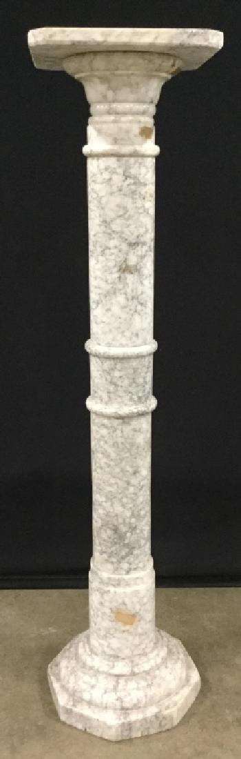 Italian White And Gray Veined Marble Pedestal: Italian white and gray veined marble pedestal / pillar / column stand. Some stickers on pedestal that read ‘Made in Italy’. Some surface wear of marble, might need polishing. Top surface can be re