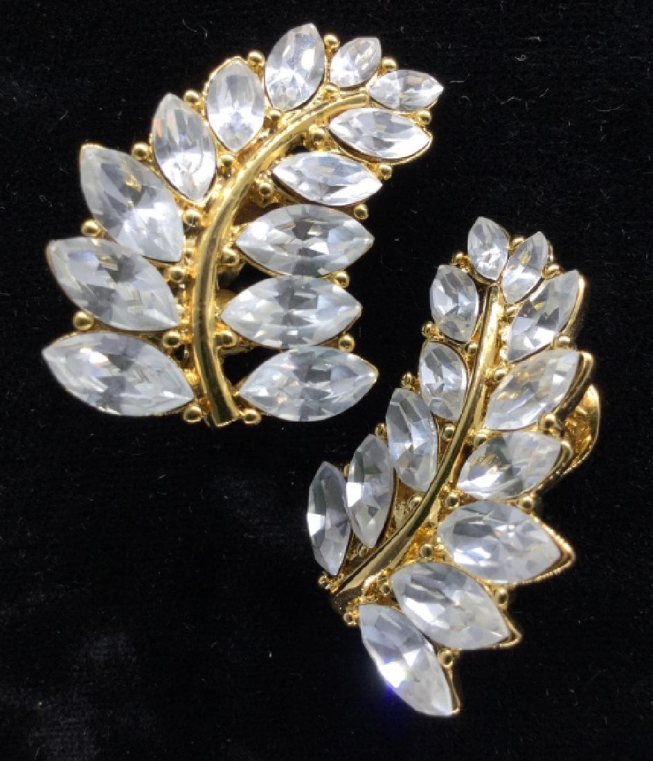 MONET Rhinestone Leaf Earrings: MONET Rhinestone Leaf Earrings, rhinestones Set in gold toned metal, Ear Clips clip on, Signed Monet on reverse, Measures approx 1 in long. Women’s vintage costume estate jewelry, fashion accessory,