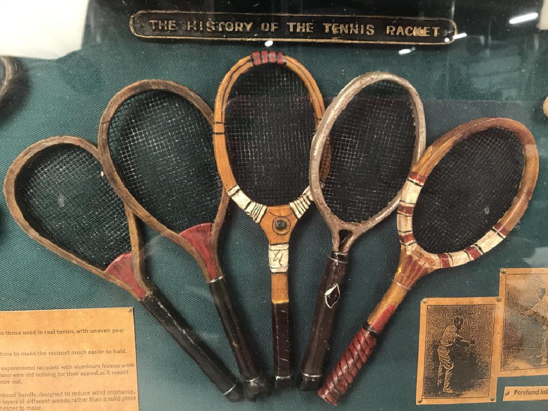 The History Of The Tennis Racket Diorama: Diorama has illustrations of various tennis strokes, Miniature tennis rackets, a trophy Figural, and more. Diorama is in wooden and glass display box. Measures approx 20.5 inches long 11 inches tall 3