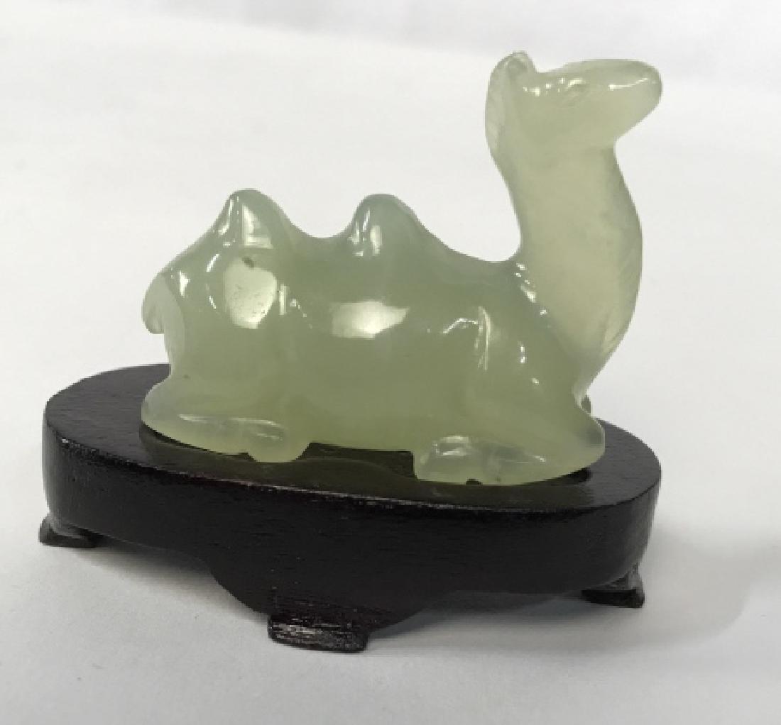 Chinese Green Jade Camel Figurine W Stand in Box: Chinese green jade camel figurine on wood stand in Patterned Jewelry Box with horn toggle closures. Jade camel figurine is approx 2 inches in length, 1.5 inches in height, 0.75 inches in width. Box is