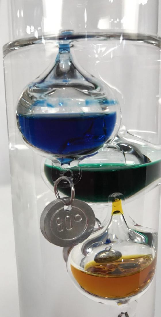 Glass Decorative Indoor Thermometer: Glass Indoor Thermometer, 12 1/2 in x 3 1/2 in , formed as an enclosed Decorative Glass cylinder with bobbing multi colored mercury vessels, good condition, Collectible Thermometers, Collectible Table