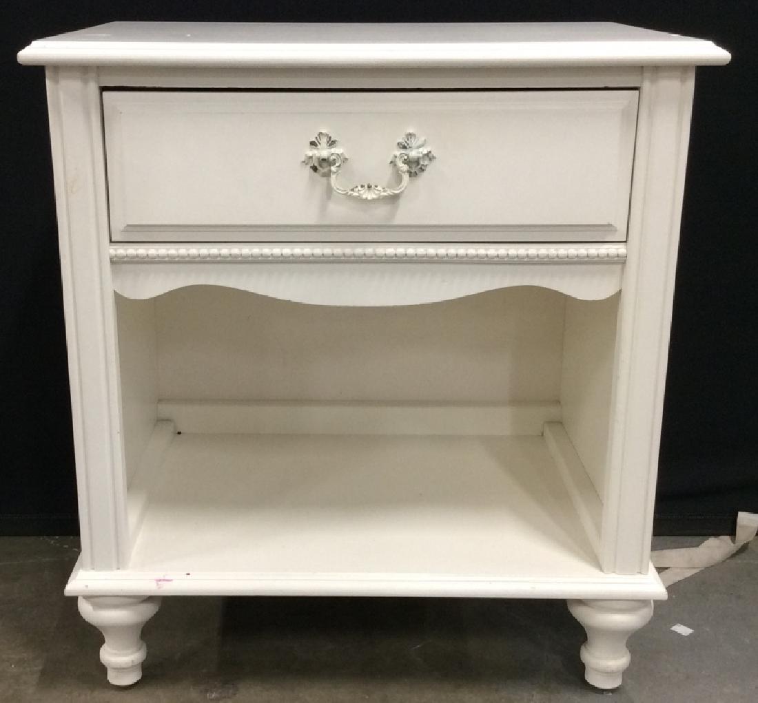 STANLEY FURNITURE CO Carved Wooden Nightstand: Nightstand is white toned. Contains 1 Drawer. Piece has 4 carved wooden feet. Measures approx 25 inches tall 23 inches wide 16 inches deep. Has some minor wear and some stains on side. Marked STANLEY 