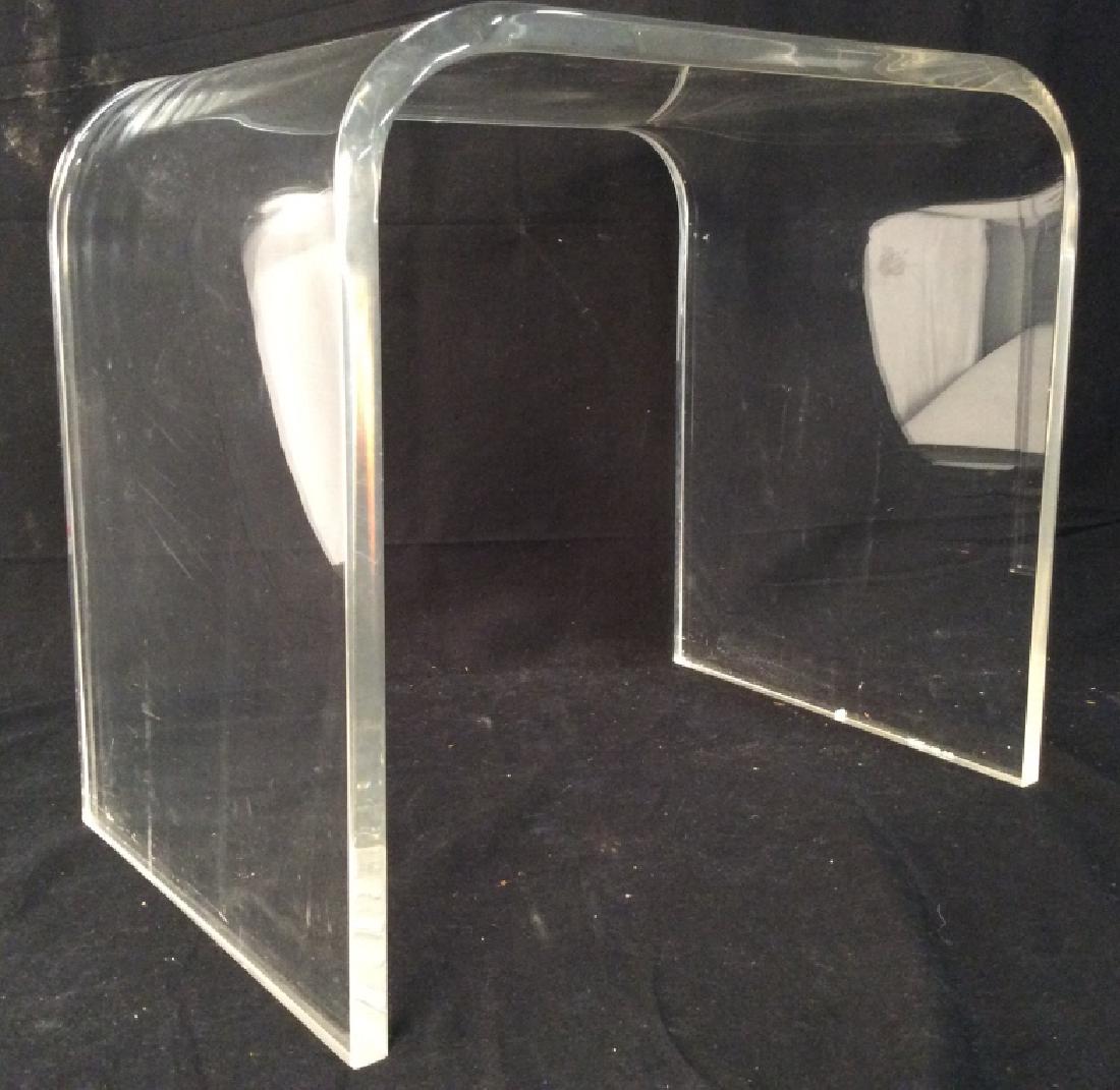 Lucite End Table: Lucite Table has rounded edges. Measures approx 18.5 inches long 16 inches tall, 12 inches deep. Lucite furniture, end table, home accessory, home furnishings.