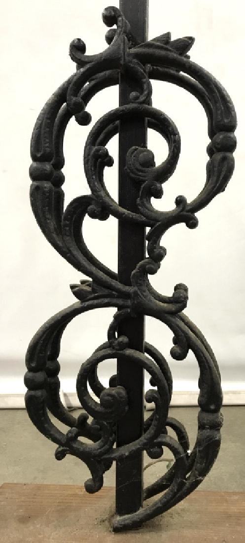 Industrial Swirl Iron Lamp W Wood Base: Industrial swirl iron lamp with wood base. Statement table lamp. Approximately 37 inches in height with harp, 13 inches by 6 inches in length and width at base. Lamp will need rewiring for plug. Lamp 