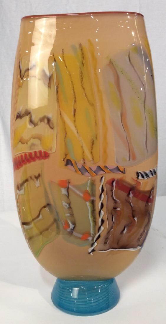 Italian Murano Style Art Glass Vessel: Italian Murano Style Glass Vessel, possibly hand blown, Posssibly Venetian, Underside Marked $595.00 Barney’s, good condition, 18 in x 9 in, at widest point through middle, multi colored oranges red