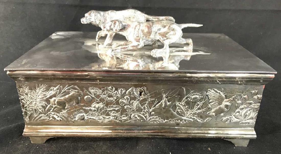 WILCOX SILVERPLATE CO Quadruple Plated KeepsakeBox: Underside reads WILCOX SILVERPLATE CO QUADRUPLE PLATED. Box has Dog Figural detail on top and intricate beveled detail around sides of box. Inside of box has 2 compartments and 1 hidden compartment. M